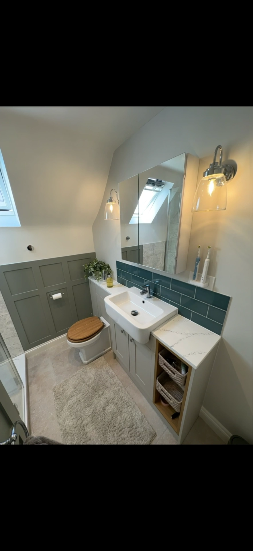 Loft cloakroom with sage panelling, teal tiles and fitted vanity — Woking bathroom installers