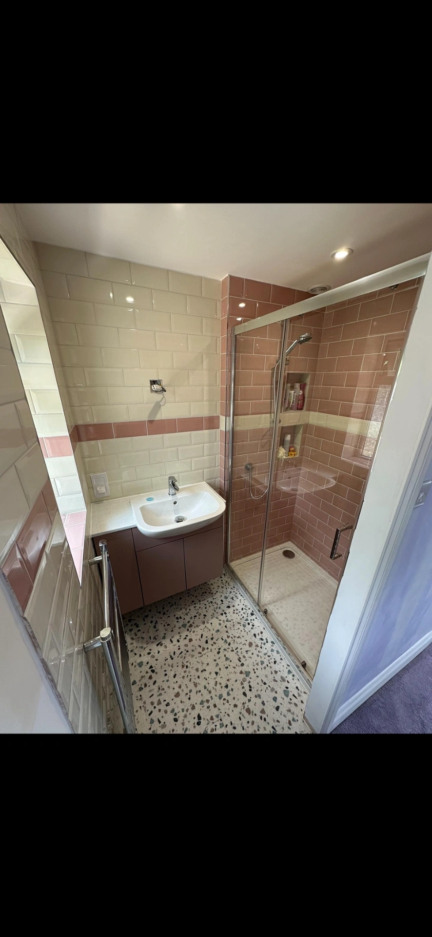 Pink and cream metro-tiled shower room with terrazzo floor — bathroom renovation Woking